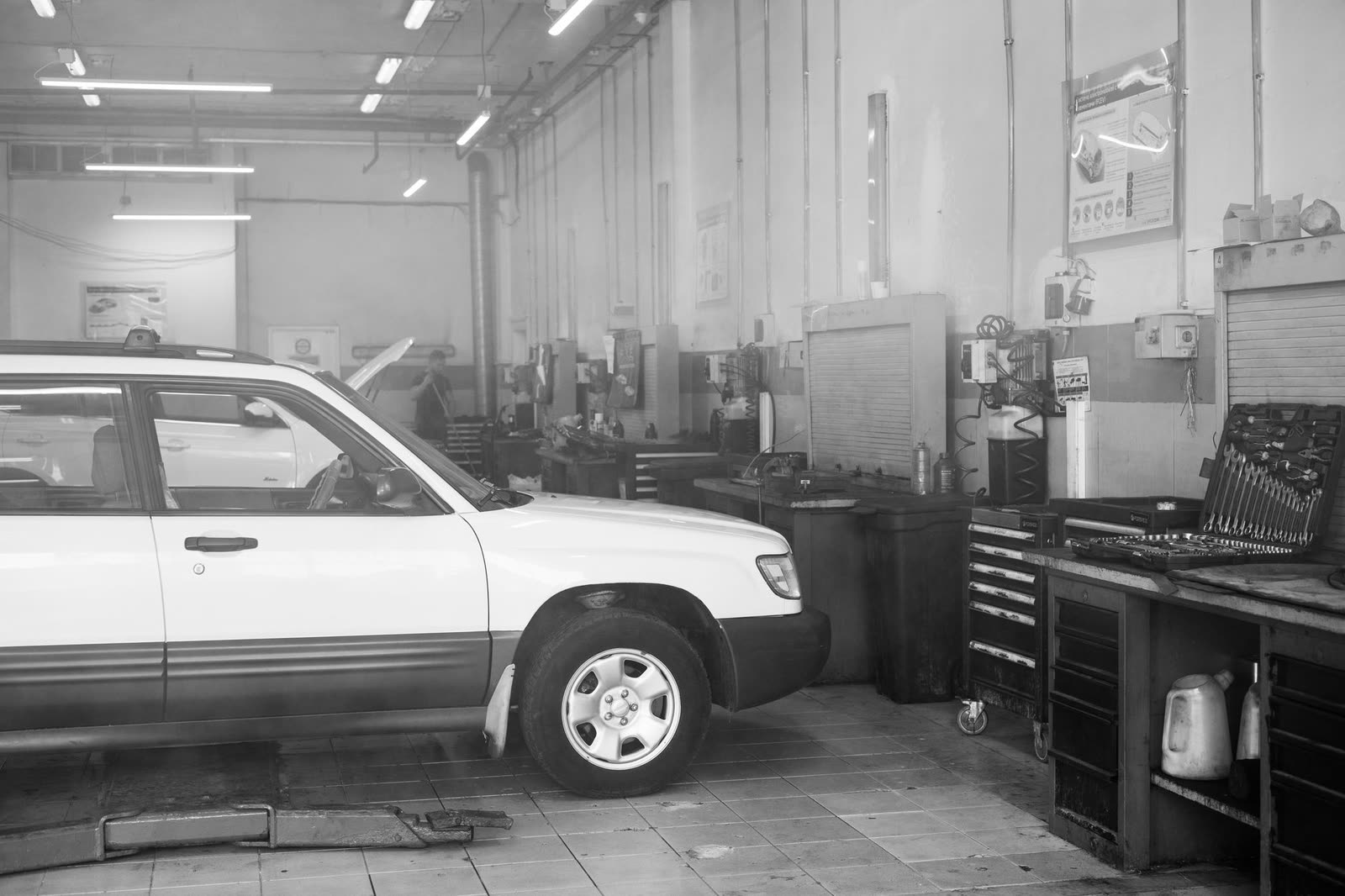 Technician replacing a brake pad and rotor
