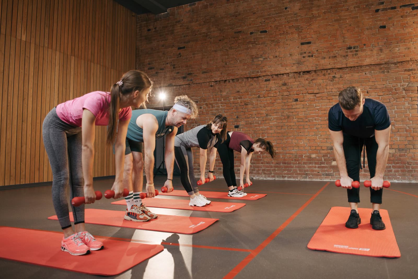Group HIIT bootcamp class mid-session at Iron Vela Fitness