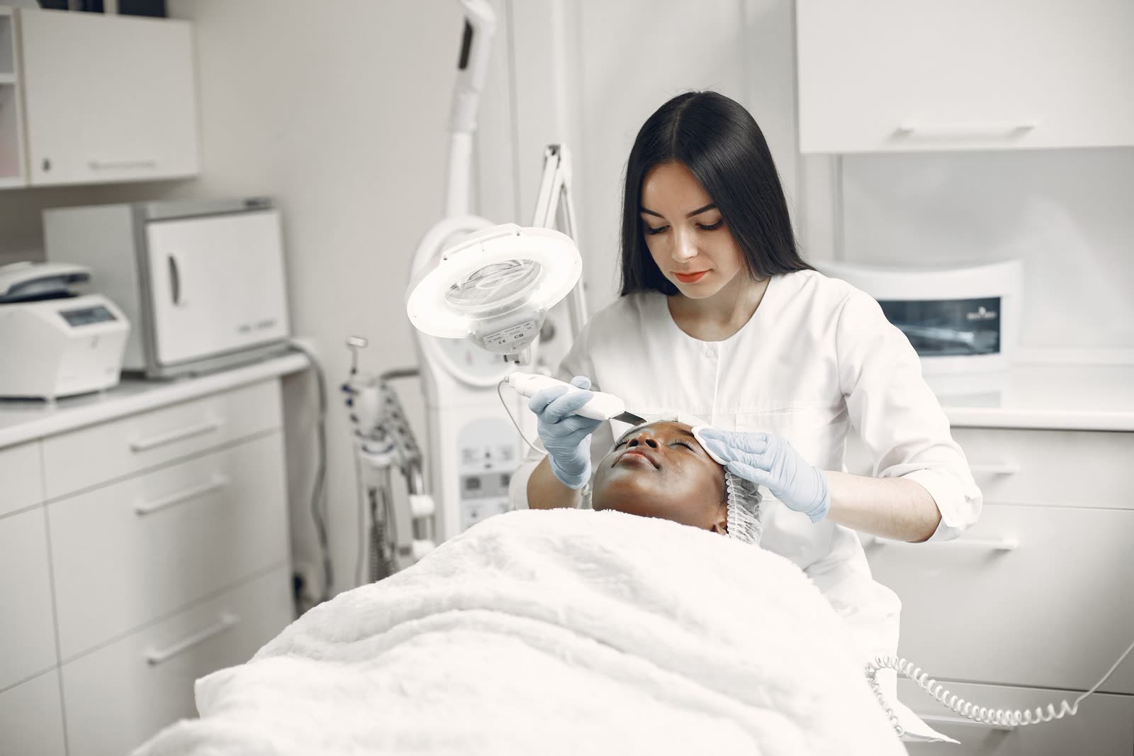 HydraFacial treatment in progress with a hydrating wand
